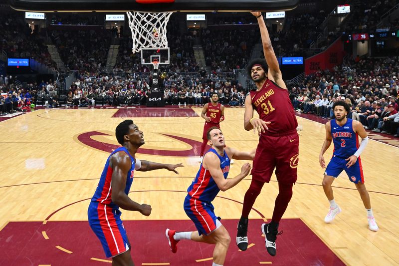 CLEVELAND, OHIO - JANUARY 31: Jarrett Allen #31 of the Cleveland Cavaliers shoots over Bojan Bogdanovic #44 of the Detroit Pistons at Rocket Mortgage Fieldhouse on January 31, 2024 in Cleveland, Ohio. The Cavaliers defeated the Pistons 128-121. (Photo by Jason Miller/Getty Images) NOTE TO USER: User expressly acknowledges and agrees that, by downloading and or using this photograph, User is consenting to the terms and conditions of the Getty Images License Agreement. (Photo by Jason Miller/Getty Images)