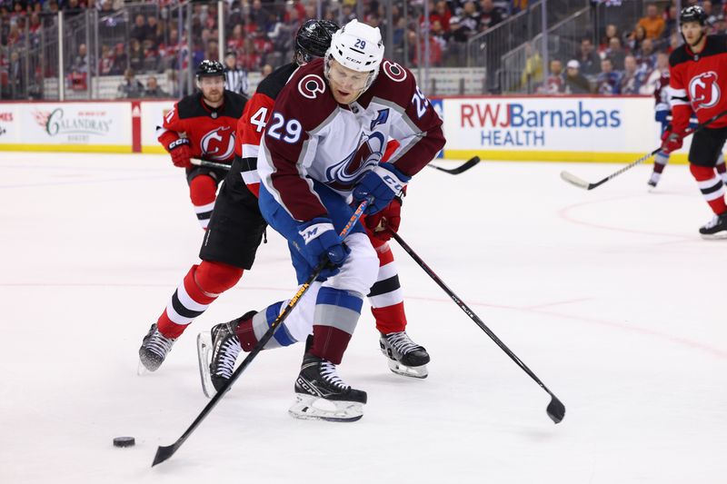 Feb 6, 2024; Newark, New Jersey, USA; Colorado Avalanche center Nathan MacKinnon (29) skates with the puck against the New Jersey Devils during the first period at Prudential Center. Mandatory Credit: Ed Mulholland-USA TODAY Sports