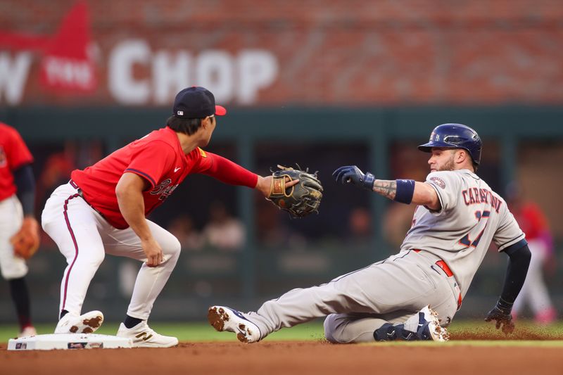 Sep 12, 2025; Atlanta, Georgia, USA; Atlanta Braves shortstop Ha-Seong Kim (9) tags out Houston Astros catcher Victor Caratini (17) in the second inning at Truist Park. Mandatory Credit: Brett Davis-Imagn Images
