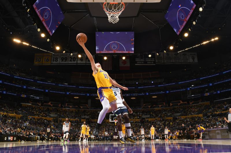 LOS ANGELES, CA - OCTOBER 22: Austin Reaves #15 of the Los Angeles Lakers drives to the basket during the game against the Minnesota Timberwolves on October 22, 2024 at Crypto.Com Arena in Los Angeles, California. NOTE TO USER: User expressly acknowledges and agrees that, by downloading and/or using this Photograph, user is consenting to the terms and conditions of the Getty Images License Agreement. Mandatory Copyright Notice: Copyright 2024 NBAE (Photo by Adam Pantozzi/NBAE via Getty Images)