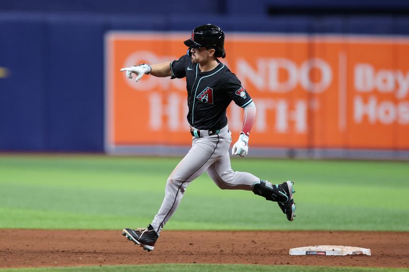 Aug 16, 2024; St. Petersburg, Florida, USA; Arizona Diamondbacks outfielder Corbin Carroll (7) runs the bases after hitting a two run home run against the Tampa Bay Rays in the ninth inning at Tropicana Field. Mandatory Credit: Nathan Ray Seebeck-USA TODAY Sports