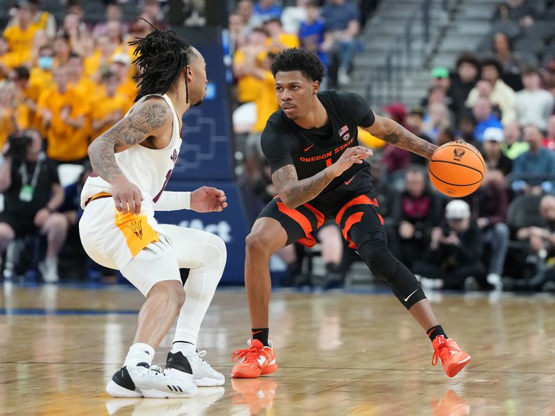 Mar 8, 2023; Las Vegas, NV, USA; Oregon State Beavers guard Christian Wright (1) dribbles against Arizona State Sun Devils guard Frankie Collins (10) during the second half at T-Mobile Arena. Mandatory Credit: Stephen R. Sylvanie-USA TODAY Sports