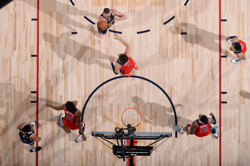 DENVER, CO - FEBRUARY 22: Nikola Jokic #15 of the Denver Nuggets shoots the ball during the game against the Washington Wizards on February 22, 2024 at the Ball Arena in Denver, Colorado. NOTE TO USER: User expressly acknowledges and agrees that, by downloading and/or using this Photograph, user is consenting to the terms and conditions of the Getty Images License Agreement. Mandatory Copyright Notice: Copyright 2024 NBAE (Photo by Bart Young/NBAE via Getty Images)