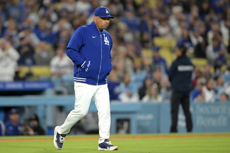 May 20, 2024; Los Angeles, California, USA; Los Angeles Dodgers manager Dave Roberts (30) walks to the mound to pull starting pitcher Yoshinobu Yamamoto (18) in the seventh inning against the Arizona Diamondbacks at Dodger Stadium. Mandatory Credit: Jayne Kamin-Oncea-USA TODAY Sports