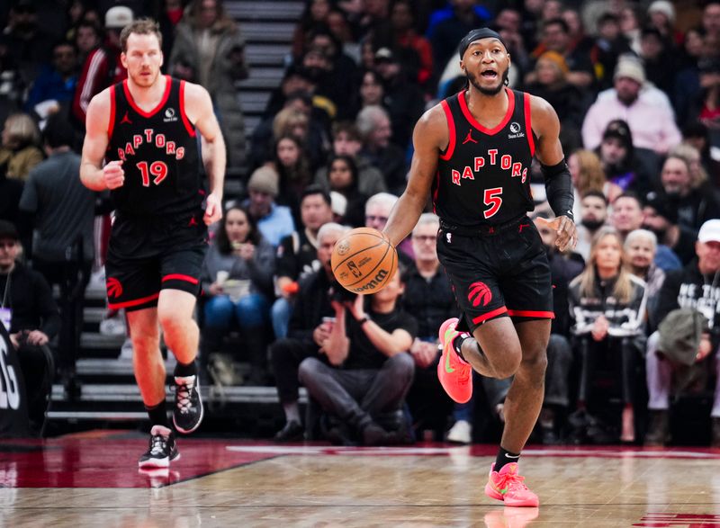 TORONTO, ON - JANUARY 31: Immanuel Quickley #5 of the Toronto Raptors dribbles the ball up court against the Chicago Bulls during the first half of their basketball game at the Scotiabank Arena on January 31, 2025 in Toronto, Ontario, Canada. NOTE TO USER: User expressly acknowledges and agrees that, by downloading and/or using this Photograph, user is consenting to the terms and conditions of the Getty Images License Agreement. (Photo by Mark Blinch/Getty Images)