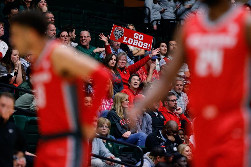 Mar 3, 2023; Fort Collins, Colorado, USA; A New Mexico Lobos fan holds up a sign in the first half against the Colorado State Rams at Moby Arena. Mandatory Credit: Isaiah J. Downing-USA TODAY Sports