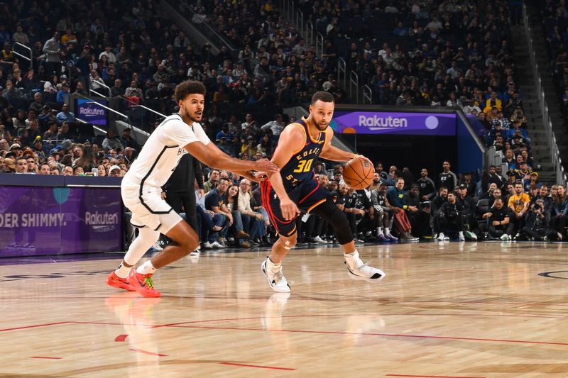 SAN FRANCISCO, CA - NOVEMBER 25: Stephen Curry #30 of the Golden State Warriors handles the ball during the game against the Brooklyn Nets on November 25, 2024 at Chase Center in San Francisco, California. NOTE TO USER: User expressly acknowledges and agrees that, by downloading and or using this photograph, user is consenting to the terms and conditions of Getty Images License Agreement. Mandatory Copyright Notice: Copyright 2024 NBAE (Photo by Noah Graham/NBAE via Getty Images)