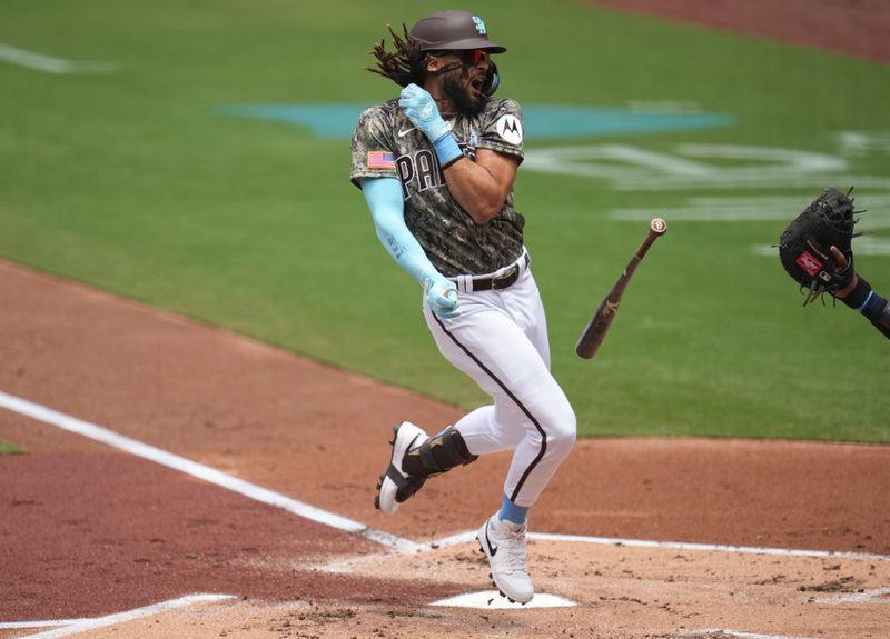 Jun 18, 2023; San Diego, California, USA;  San Diego Padres right fielder Fernando Tatis Jr. (23) reacts to being hit by a pitch during the first inning against the Tampa Bay Rays at Petco Park. Mandatory Credit: Ray Acevedo-USA TODAY Sports