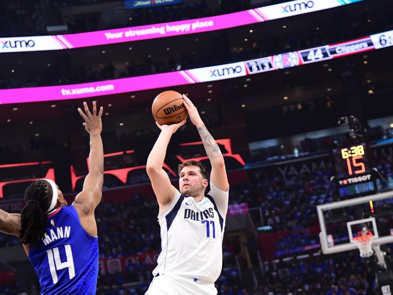 LOS ANGELES, CA - APRIL 21:  Luka Doncic #77 of the Dallas Mavericks shoots the ball during the game against the LA Clippers during Round 1 Game 1 of the 2024 NBA Playoffs on April 21, 2024 at Crypto.Com Arena in Los Angeles, California. NOTE TO USER: User expressly acknowledges and agrees that, by downloading and/or using this Photograph, user is consenting to the terms and conditions of the Getty Images License Agreement. Mandatory Copyright Notice: Copyright 2024 NBAE (Photo by Adam Pantozzi/NBAE via Getty Images)