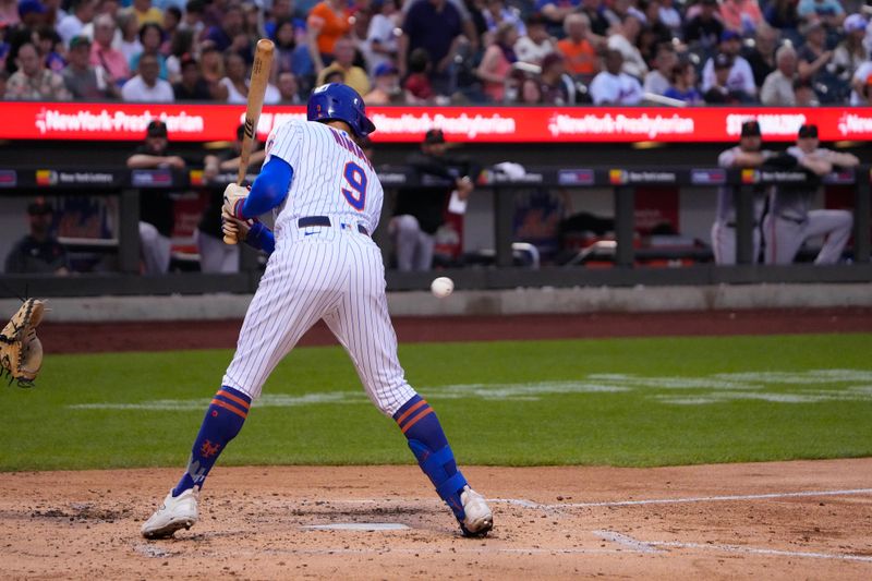 Jul 2, 2023; New York City, New York, USA; New York Mets center fielder Brandon Nimmo (9) is hit by a pitch against the San Francisco Giants during the third inning at Citi Field. Mandatory Credit: Gregory Fisher-USA TODAY Sports