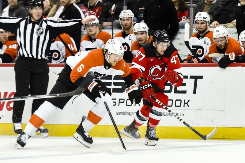 Jan 29, 2025; Newark, New Jersey, USA; Philadelphia Flyers defenseman Travis Sanheim (6) and New Jersey Devils center Paul Cotter (47) compete for the puck during the first period at Prudential Center. Mandatory Credit: John Jones-Imagn Images