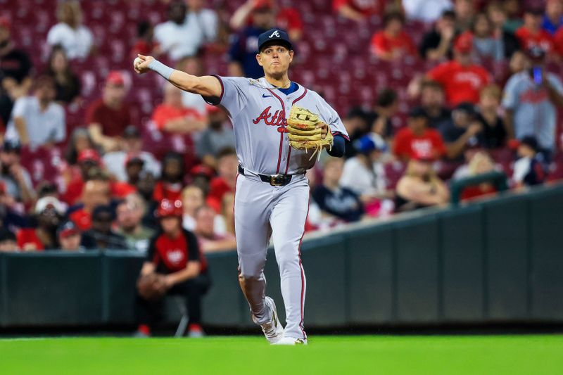 Sep 17, 2024; Cincinnati, Ohio, USA; Atlanta Braves third baseman Gio Urshela (9) throws to first to get Cincinnati Reds second baseman Jonathan India (not pictured) out in the eighth inning at Great American Ball Park. Mandatory Credit: Katie Stratman-Imagn Images