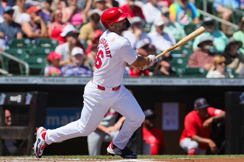 Mar 11, 2024; Jupiter, Florida, USA; St. Louis Cardinals first baseman Paul Goldschmidt (46) hits a double against the Washington Nationals during the first inning at Roger Dean Chevrolet Stadium. Mandatory Credit: Sam Navarro-USA TODAY Sports