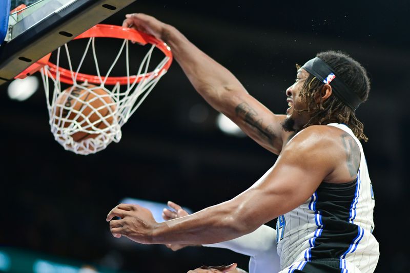 ORLANDO, FLORIDA - OCTOBER 18: Wendell Carter Jr. #34 of the Orlando Magic dunks the ball in the second half of a game against the Philadelphia 76ers at Kia Center on October 18, 2024 in Orlando, Florida. NOTE TO USER: User expressly acknowledges and agrees that, by downloading and or using this photograph, User is consenting to the terms and conditions of the Getty Images License Agreement. (Photo by Julio Aguilar/Getty Images)