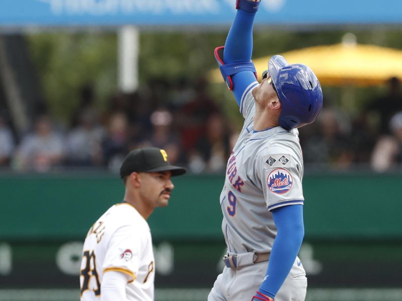 Jul 7, 2024; Pittsburgh, Pennsylvania, USA;  New York Mets left tfielder Brandon Nimmo (9) reacts at second base after hitting an RBI double against the Pittsburgh Pirates during the eighth inning at PNC Park. The Mets won 3-2. Mandatory Credit: Charles LeClaire-USA TODAY Sports