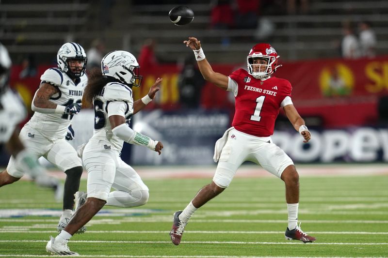 Sep 30, 2023; Fresno, California, USA; Fresno State Bulldogs quarterback Mikey Keene (1) throws a pass over the top of Nevada Wolf Pack linebacker Tongiaki Mateialona (36) in the fourth quarter at Valley Children's Stadium. Mandatory Credit: Cary Edmondson-USA TODAY Sports