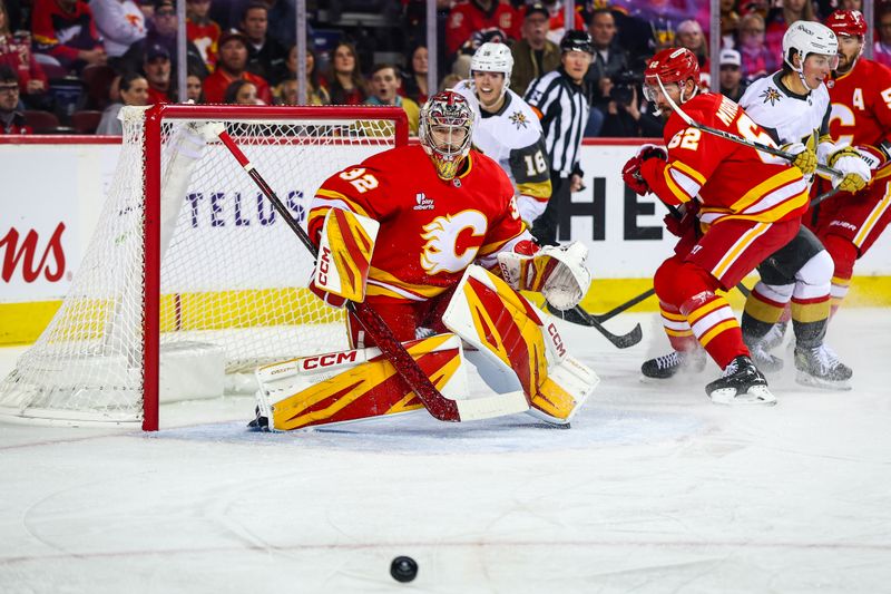 Oct 14, 2025; Calgary, Alberta, CAN; Calgary Flames goaltender Dustin Wolf (32) guards his net against the Vegas Golden Knights during the first period at Scotiabank Saddledome. Mandatory Credit: Sergei Belski-Imagn Images