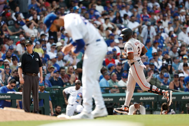 Jun 19, 2024; Chicago, Illinois, USA; San Francisco Giants designated hitter Jorge Soler (2) rounds the bases after hitting a grand slam against the Chicago Cubs during the eight inning at Wrigley Field. Mandatory Credit: Kamil Krzaczynski-USA TODAY Sports