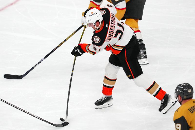 Apr 18, 2024; Las Vegas, Nevada, USA; Anaheim Ducks center Isac Lundestrom (21) shoots against the Vegas Golden Knights during the third period at T-Mobile Arena. Mandatory Credit: Stephen R. Sylvanie-USA TODAY Sports