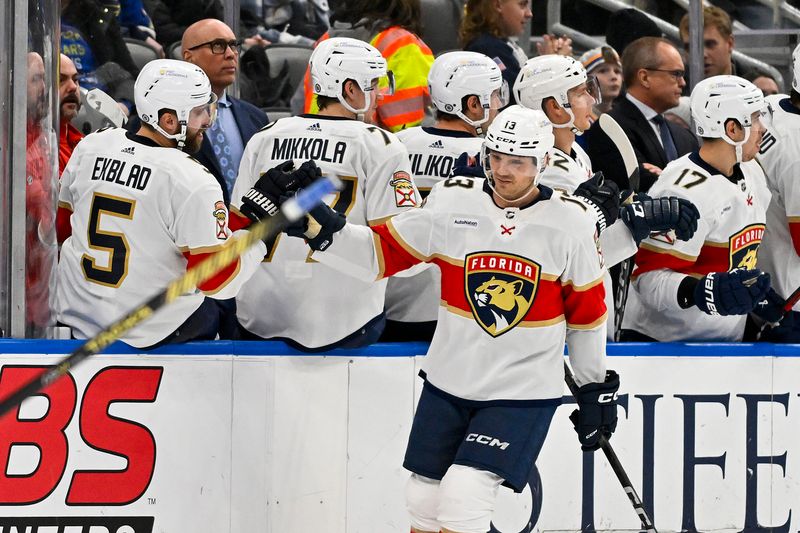 Jan 9, 2024; St. Louis, Missouri, USA;  Florida Panthers center Sam Reinhart (13) is congratulated by defenseman Aaron Ekblad (5) after scoring against the St. Louis Blues during the second period at Enterprise Center. Mandatory Credit: Jeff Curry-USA TODAY Sports