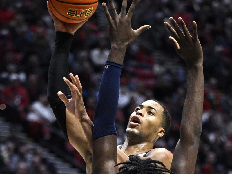 Jan 3, 2024; San Diego, California, USA; San Diego State Aztecs forward Jaedon LeDee (13) goes to the basket past Fresno State Bulldogs center Eduardo Andre (35) during the second half at Viejas Arena. Mandatory Credit: Orlando Ramirez-USA TODAY Sports 