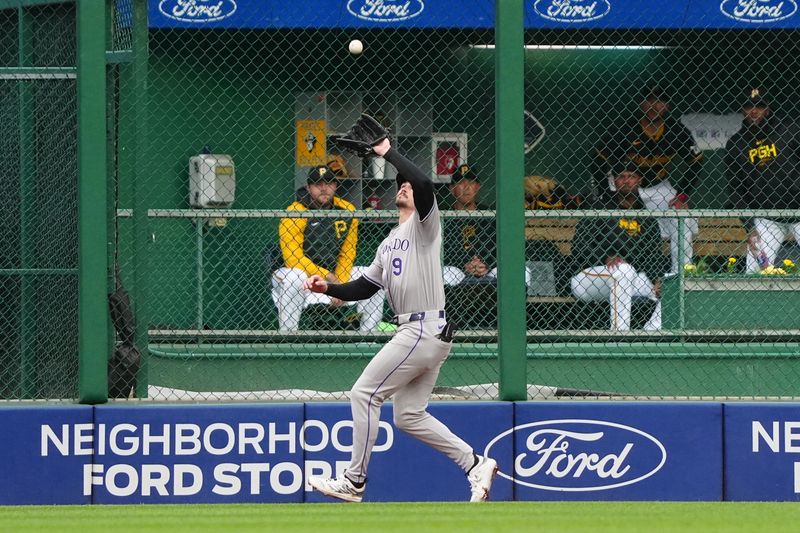 May 4, 2024; Pittsburgh, Pennsylvania, USA; Colorado Rockies center fielder Brenton Doyle (9) catches a fly ball hit by Pittsburgh Pirates catcher Yasmani Grandal (not pictured) during the fourth inning at PNC Park. Mandatory Credit: Gregory Fisher-USA TODAY Sports