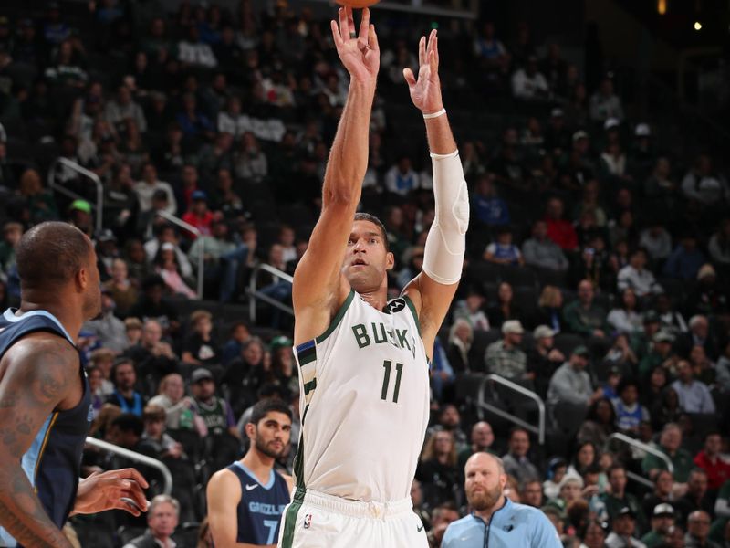 MILWAUKEE, WI - OCTOBER 20: Brook Lopez #11 of the Milwaukee Bucks shoots a three point basket during the preseason game on October 20, 2023 at the Fiserv Forum Center in Milwaukee, Wisconsin. NOTE TO USER: User expressly acknowledges and agrees that, by downloading and or using this Photograph, user is consenting to the terms and conditions of the Getty Images License Agreement. Mandatory Copyright Notice: Copyright 2023 NBAE (Photo by Gary Dineen/NBAE via Getty Images).