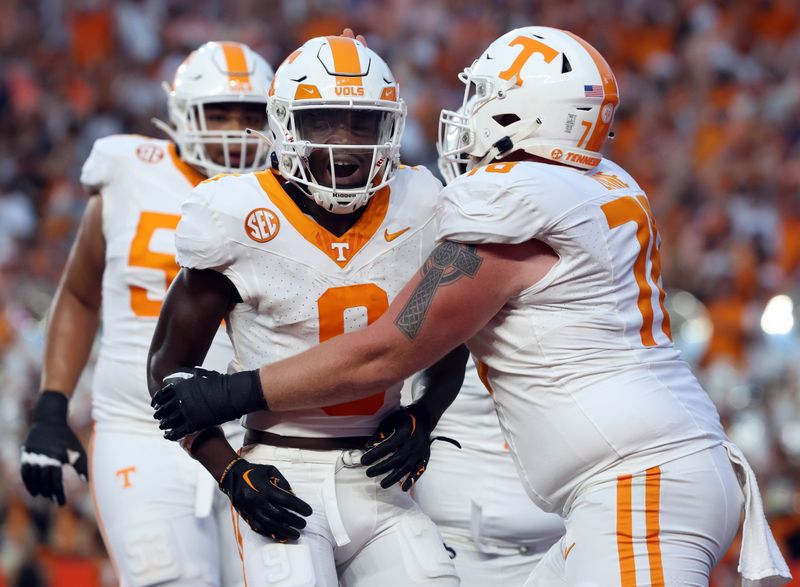 Sep 16, 2023; Gainesville, Florida, USA; Tennessee Volunteers wide receiver Ramel Keyton (9) is congratulated after he scored a touchdown against the Florida Gators during the first quarter at Ben Hill Griffin Stadium. Mandatory Credit: Kim Klement Neitzel-USA TODAY Sports