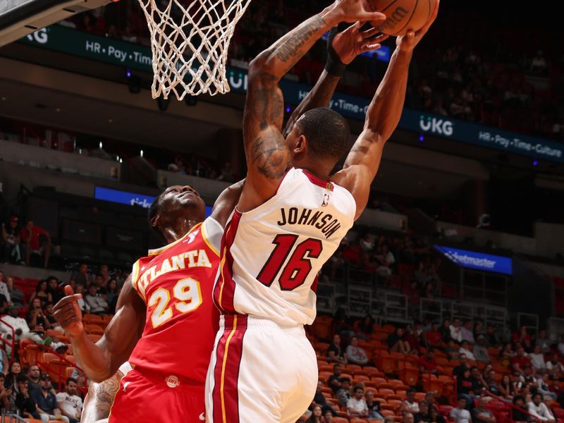 MIAMI, FL - OCTOBER 16: Daeqwon Plowden #29 of the Atlanta Hawks blocks the ball during the game against the Miami Heat on October 16, 2024 at Miami-Dade Arena in Miami, Florida. NOTE TO USER: User expressly acknowledges and agrees that, by downloading and or using this Photograph, user is consenting to the terms and conditions of the Getty Images License Agreement. Mandatory Copyright Notice: Copyright 2024 NBAE (Photo by Issac Baldizon/NBAE via Getty Images)