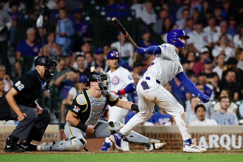 Sep 4, 2024; Chicago, Illinois, USA; Chicago Cubs outfielder Pete Crow-Armstrong (52) hits and RBI-single against the Pittsburgh Pirates during the fifth inning at Wrigley Field. Mandatory Credit: Kamil Krzaczynski-Imagn Images