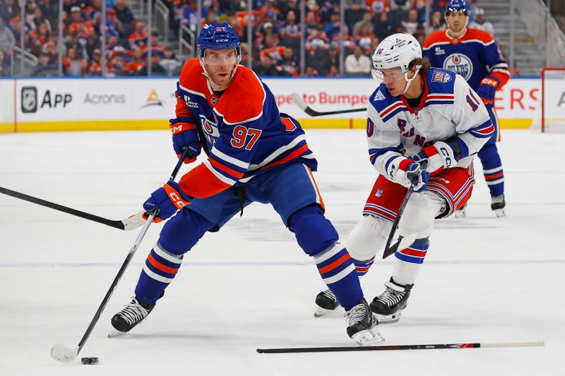 Oct 30, 2025; Edmonton, Alberta, CAN; Edmonton Oilers forward Connor McDavid (97) looks to make a pass in front of New York Rangers forward Artemi Panarin (10) during the first period at Rogers Place. Mandatory Credit: Perry Nelson-Imagn Images