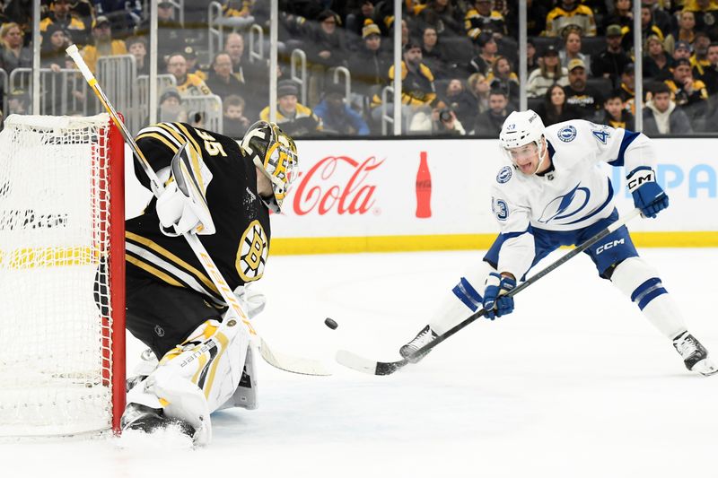 Feb 13, 2024; Boston, Massachusetts, USA;  Tampa Bay Lightning defenseman Darren Raddysh (43) tries to tip the puck past Boston Bruins goaltender Linus Ullmark (35) during the third period at TD Garden. Mandatory Credit: Bob DeChiara-USA TODAY Sports