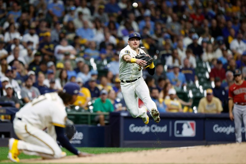 Oct 4, 2023; Milwaukee, Wisconsin, USA; Milwaukee Brewers third baseman Josh Donaldson (3) throws to first in the fourth inning against the Arizona Diamondbacks during game two of the Wildcard series for the 2023 MLB playoffs at American Family Field. Mandatory Credit: Kamil Krzaczynski-USA TODAY Sports