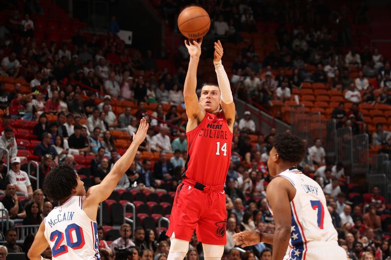 MIAMI, FL - NOVEMBER 18: Tyler Herro #14 of the Miami Heat jump shot against the Philadelphia 76ers on November 18, 2024 at Kaseya Center in Miami, Florida. NOTE TO USER: User expressly acknowledges and agrees that, by downloading and or using this Photograph, user is consenting to the terms and conditions of the Getty Images License Agreement. Mandatory Copyright Notice: Copyright 2024 NBAE (Photo by Issac Baldizon/NBAE via Getty Images)