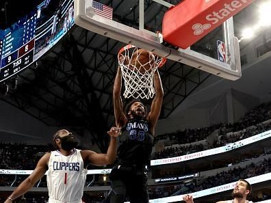 DALLAS, TEXAS - DECEMBER 20: Derrick Jones Jr. #55 of the Dallas Mavericks dunks the ball against James Harden #1 of the LA Clippers in the first half at American Airlines Center on December 20, 2023 in Dallas, Texas. NOTE TO USER: User expressly acknowledges and agrees that, by downloading and or using this photograph, User is consenting to the terms and conditions of the Getty Images License Agreement. (Photo by Tim Heitman/Getty Images)