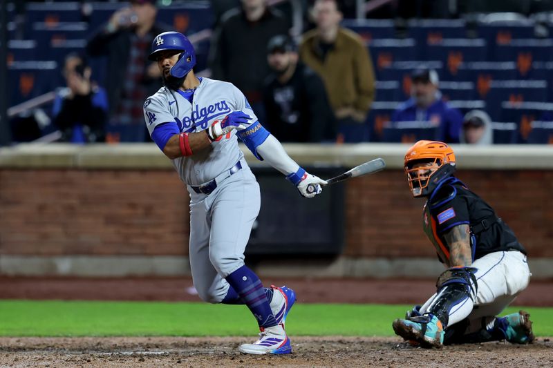 May 23, 2025; New York City, New York, USA; Los Angeles Dodgers right fielder Teoscar Hernandez (37) follows through on an RBI single against the New York Mets during the thirteenth inning at Citi Field. Mandatory Credit: Brad Penner-Imagn Images