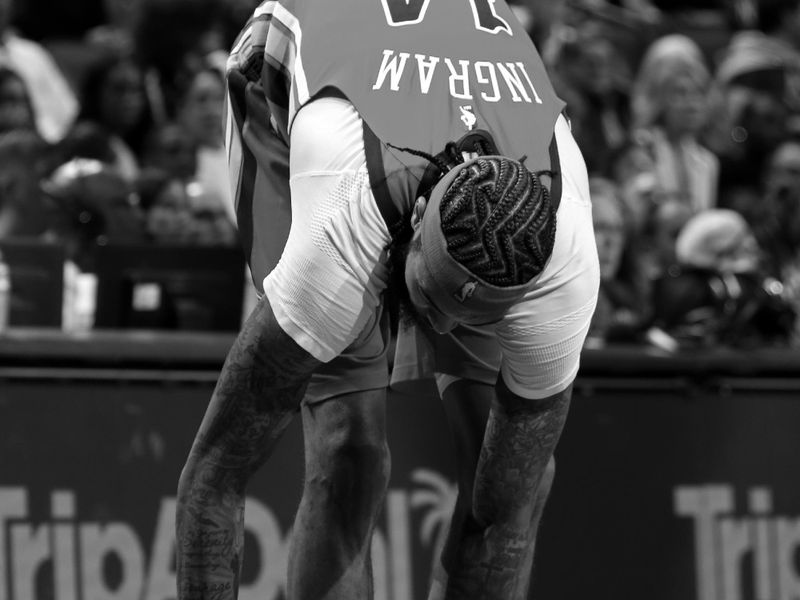 NEW ORLEANS, LA - NOVEMBER 15:(EDITOR'S NOTE: Image has been converted to black and white) Brandon Ingram #14 of the New Orleans Pelicans ties sneakers during the game against the Denver Nuggets during the Emirates NBA Cup game on November 15, 2024 at the Smoothie King Center in New Orleans, Louisiana. NOTE TO USER: User expressly acknowledges and agrees that, by downloading and or using this Photograph, user is consenting to the terms and conditions of the Getty Images License Agreement. Mandatory Copyright Notice: Copyright 2024 NBAE (Photo by Layne Murdoch Jr./NBAE via Getty Images)