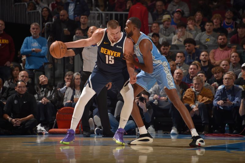 CLEVELAND, OH - DECEMBER 8: Nikola Jokic #15 of the Denver Nuggets dribbles the ball during the game against the Cleveland Cavaliers on December 5, 2024 at Rocket Mortgage FieldHouse in Cleveland, Ohio. NOTE TO USER: User expressly acknowledges and agrees that, by downloading and/or using this Photograph, user is consenting to the terms and conditions of the Getty Images License Agreement. Mandatory Copyright Notice: Copyright 2024 NBAE (Photo by David Liam Kyle/NBAE via Getty Images)