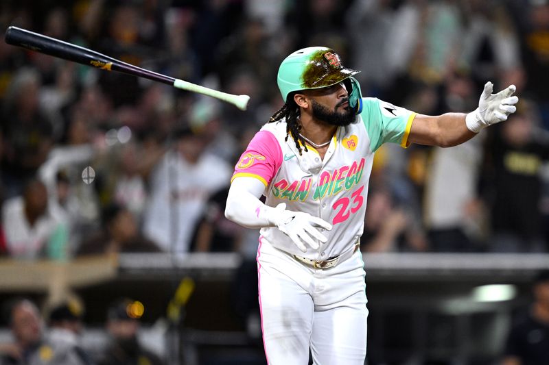 Sep 20, 2024; San Diego, California, USA; San Diego Padres right fielder Fernando Tatis Jr. (23) tosses his bat after hitting a walk-off double during the tenth inning against the Chicago White Sox at Petco Park. Mandatory Credit: Orlando Ramirez-Imagn Images