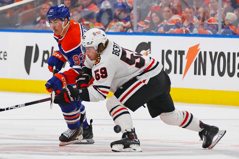 Nov 1, 2025; Edmonton, Alberta, CAN;  Chicago Blackhawks forward Tyler Bertuzzi (59) and Edmonton Oilers forward Ryan Nugent-Hopkins (93) battle for a loose puck during the third periodat Rogers Place. Mandatory Credit: Perry Nelson-Imagn Images