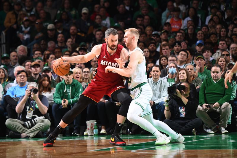 BOSTON, MA - APRIL 21: Kevin Love #42 of the Miami Heat dribbles the ball during the game against the Boston Celtics during Round 1 Game 1 of the 2024 NBA Playoffs on April 21, 2024 at the TD Garden in Boston, Massachusetts. NOTE TO USER: User expressly acknowledges and agrees that, by downloading and or using this photograph, User is consenting to the terms and conditions of the Getty Images License Agreement. Mandatory Copyright Notice: Copyright 2024 NBAE  (Photo by Brian Babineau/NBAE via Getty Images)