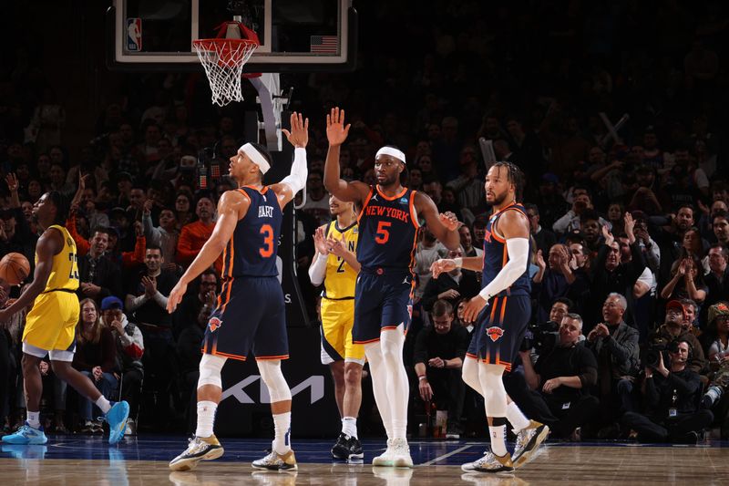 NEW YORK, NY - FEBRUARY 1: Precious Achiuwa #5 high fives Josh Hart #3 of the New York Knicks during the game against the Indiana Pacers on February 1, 2024 at Madison Square Garden in New York City, New York.  NOTE TO USER: User expressly acknowledges and agrees that, by downloading and or using this photograph, User is consenting to the terms and conditions of the Getty Images License Agreement. Mandatory Copyright Notice: Copyright 2024 NBAE  (Photo by Nathaniel S. Butler/NBAE via Getty Images)