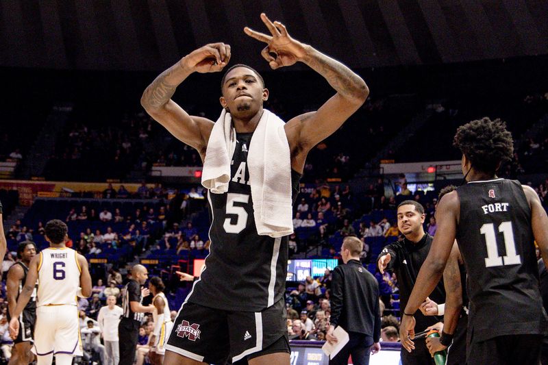 Feb 24, 2024; Baton Rouge, Louisiana, USA; Mississippi State Bulldogs guard Shawn Jones Jr. (5) reacts to a three point basket during the second half at Pete Maravich Assembly Center. Mandatory Credit: Stephen Lew-USA TODAY Sports