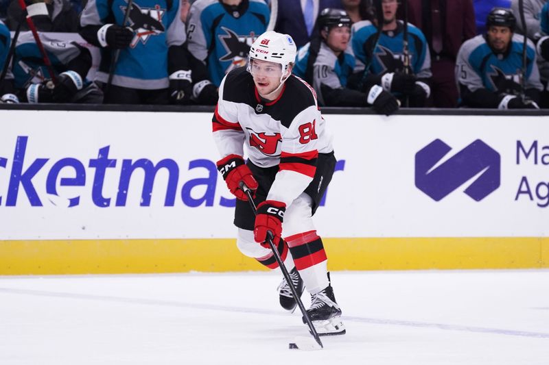 Oct 30, 2025; San Jose, California, USA;  New Jersey Devils right wing Arseny Gritsyuk (81) advances the puck against the San Jose Sharks in the first period at SAP Center at San Jose. Mandatory Credit: David Gonzales-Imagn Images