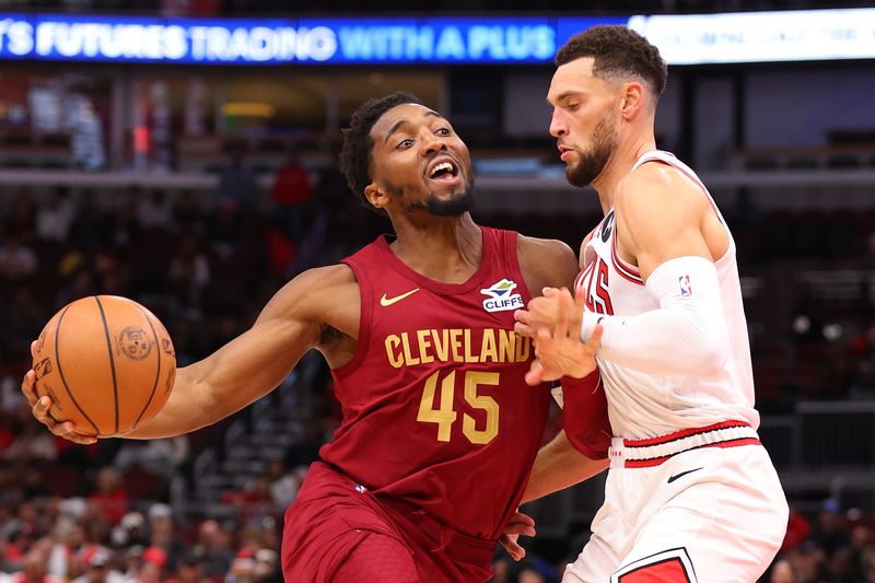 CHICAGO, ILLINOIS - OCTOBER 18: Donovan Mitchell #45 of the Cleveland Cavaliers drives to the basket against Zach LaVine #8 of the Chicago Bulls during the first half of a preseason game at the United Center on October 18, 2024 in Chicago, Illinois. NOTE TO USER: User expressly acknowledges and agrees that, by downloading and or using this photograph, User is consenting to the terms and conditions of the Getty Images License Agreement.  (Photo by Michael Reaves/Getty Images)