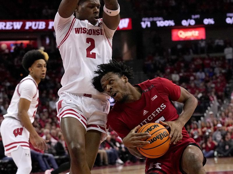 Mar 7, 2024; Madison, Wisconsin, USA; Rutgers guard Daniel Vessey (23) runs into Wisconsin guard AJ Storr (2) during the first half of their game at the Kohl Center in Madison, Wisconsin. Mark Hoffman/Milwaukee Journal Sentinel