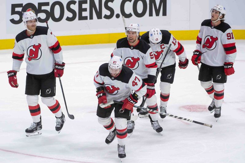 Oct 17, 2024; Ottawa, Ontario, CAN; New Jersey Devils center Paul Cotter (47) skates to the bench following his goal scored in the third period against the Ottawa Senators at the Canadian Tire Centre. Mandatory Credit: Marc DesRosiers-Imagn Images