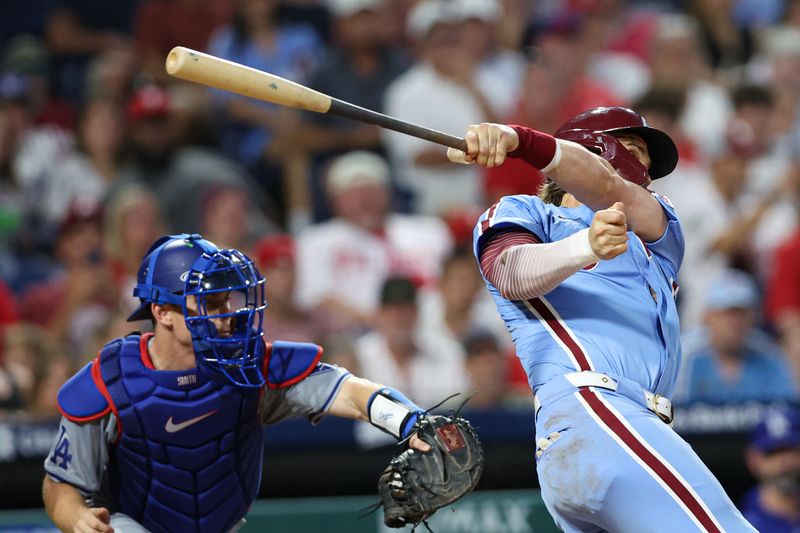 Jul 11, 2024; Philadelphia, Pennsylvania, USA; Philadelphia Phillies first base Bryce Harper (3) looses grip on his bat while swinging for a pitch during the eighth inning against the Los Angeles Dodgers at Citizens Bank Park. Mandatory Credit: Bill Streicher-USA TODAY Sports