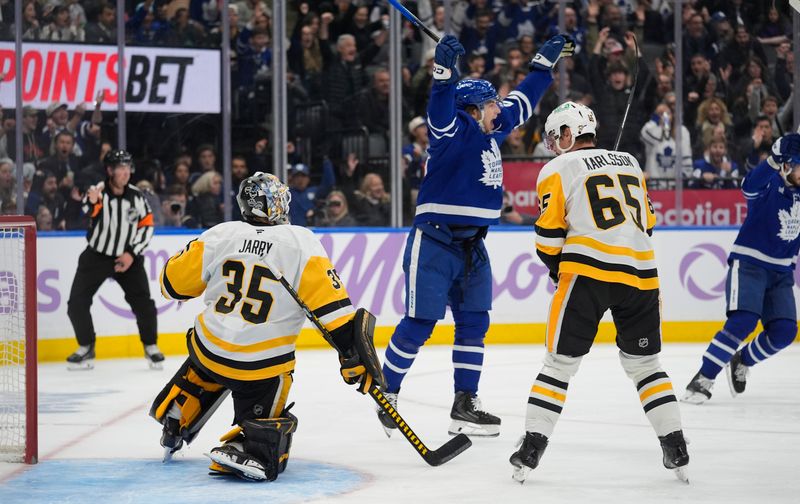 Nov 3, 2025; Toronto, Ontario, CAN; Toronto Maple Leafs forward Matthew Knies (23) celebrates a goal by forward William Nylander (not pictured) in the third period against the Pittsburgh Penguins at Scotiabank Arena. Mandatory Credit: John E. Sokolowski-Imagn Images