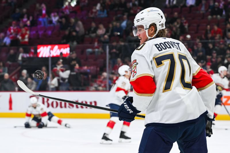 Mar 15, 2025; Montreal, Quebec, CAN; Florida Panthers center Jesper Boqvist (70) plays with a puck in warm-up before the game against the Montreal Canadiens at Bell Centre. Mandatory Credit: David Kirouac-Imagn Images